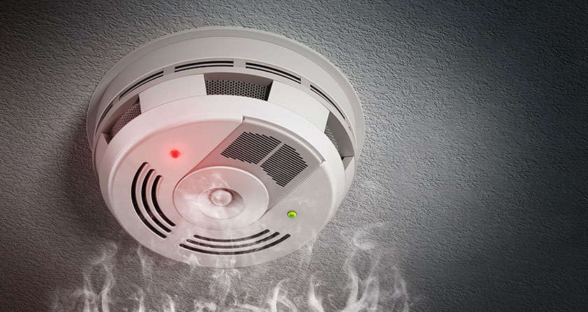 Alarming smoke detector on the ceiling. 3D illustration